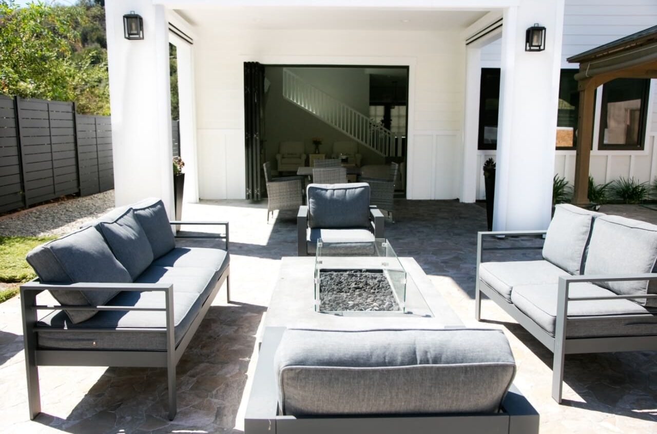 A patio with couches and tables in it